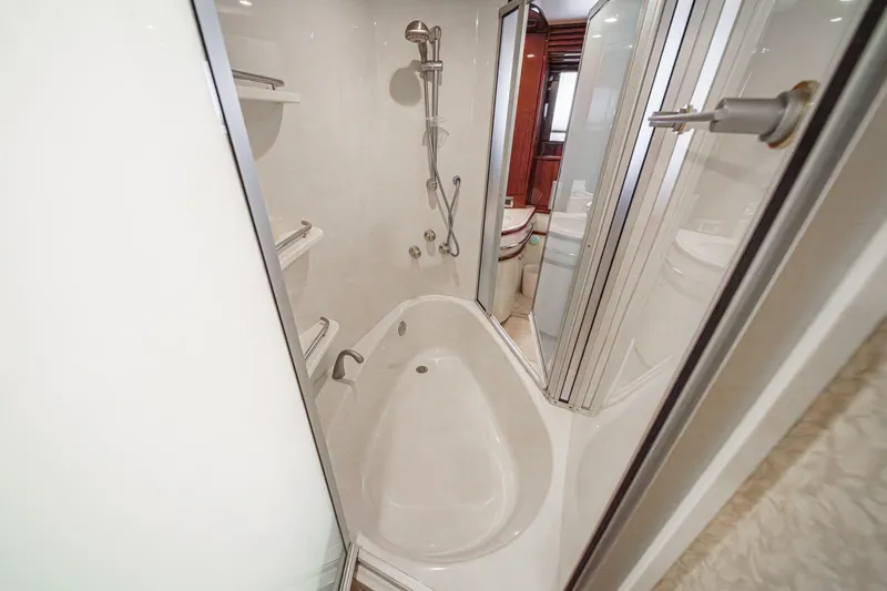Slide: The Image of Luxurious bathroom in 2005 Marquis 65 yacht with modern shower and tub. - 66