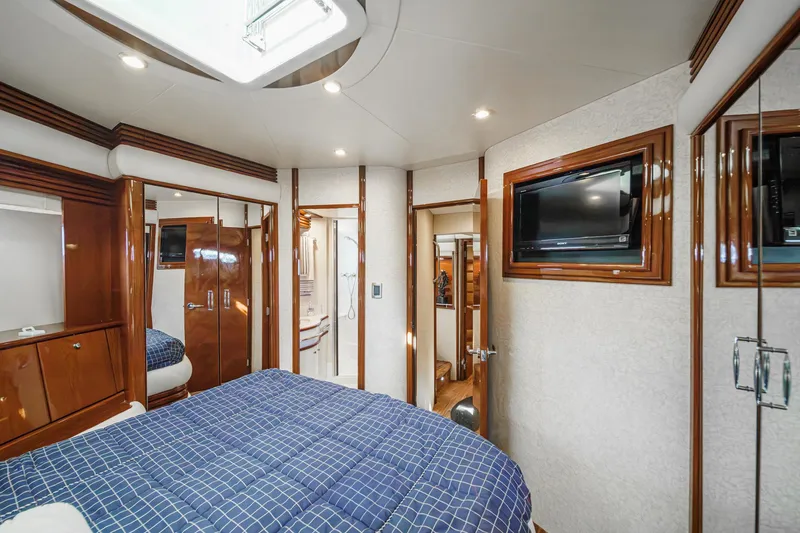Slide: The Image of Luxurious interior of 2005 Marquis 65 yacht with elegant wood finishes and modern amenities. - 70