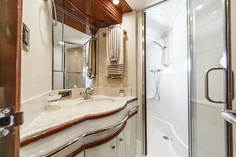 Slide: The Image of Luxurious bathroom in 2005 Marquis 65 yacht with elegant fixtures and glass shower. - 71