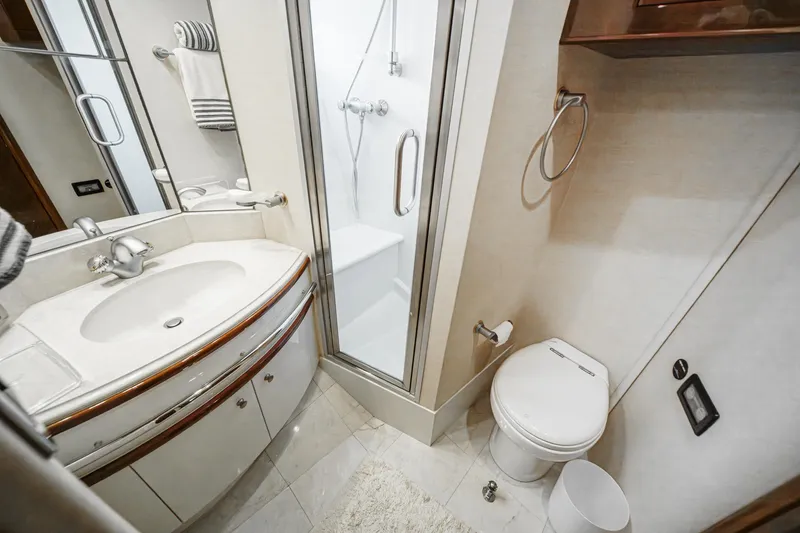 Slide: The Image of Luxurious bathroom in 2005 Marquis 65 yacht with shower, sink, and toilet. - 74