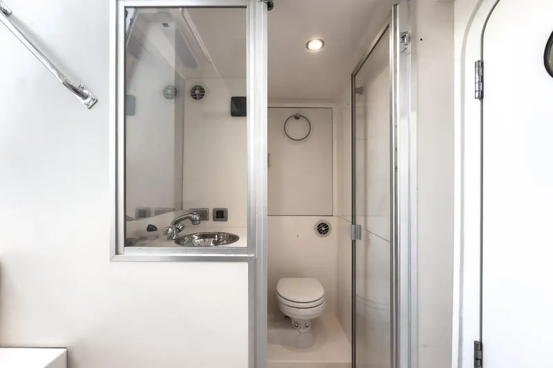 Slide: The Image of Luxurious bathroom in 2005 Marquis 65 yacht with modern fixtures and shower. - 76