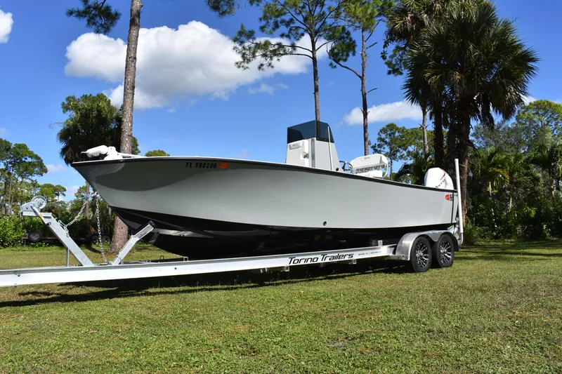 Slide: The Image of 2025 Latitude Tournament Boats 25 cruising on open water, showcasing speed and performance. - 1