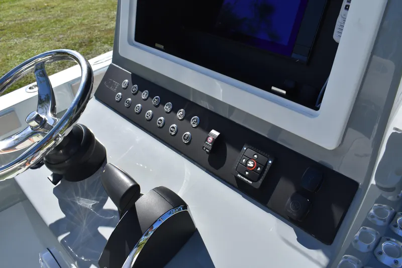 Slide: The Image of Control panel of 2025 Latitude Tournament Boats 25 with Simrad display and radio. - 15