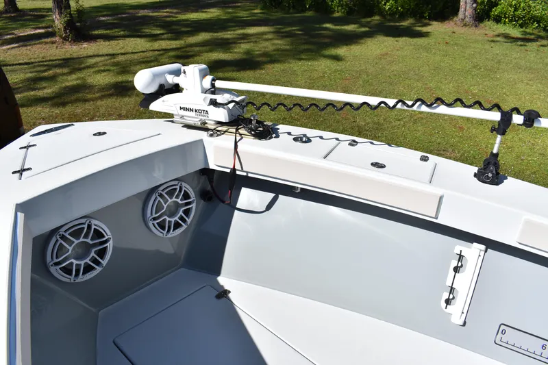 Slide: The Image of 2025 Latitude Tournament Boats 25 dashboard with steering wheel and navigation system. - 16