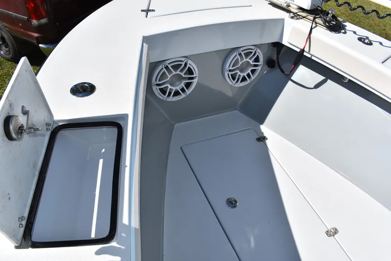 Slide: The Image of 2025 Latitude Tournament Boats 25 helm with steering wheel, control panel, and navigation display. - 17