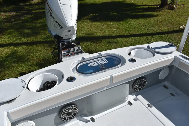 Slide: The Image of 2025 Latitude Tournament Boats 25 with seating and Yeti cooler on deck. - 22