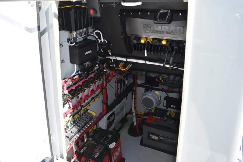 Slide: The Image of Engine compartment of 2025 Latitude Tournament Boats 25, showcasing valves and hoses. - 28