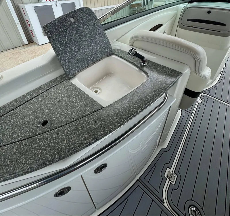Slide: The Image of 2007 Chaparral SSX 276 boat interior with sink and seating area. - 16