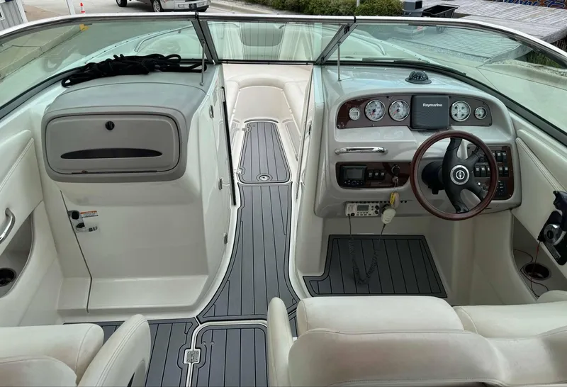 Slide: The Image of 2007 Chaparral SSX 276 boat interior with sleek dashboard and comfortable seating. - 17