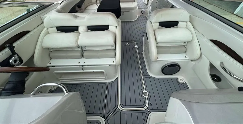 Slide: The Image of 2007 Chaparral SSX 276 boat interior with white seating and gray flooring. - 18