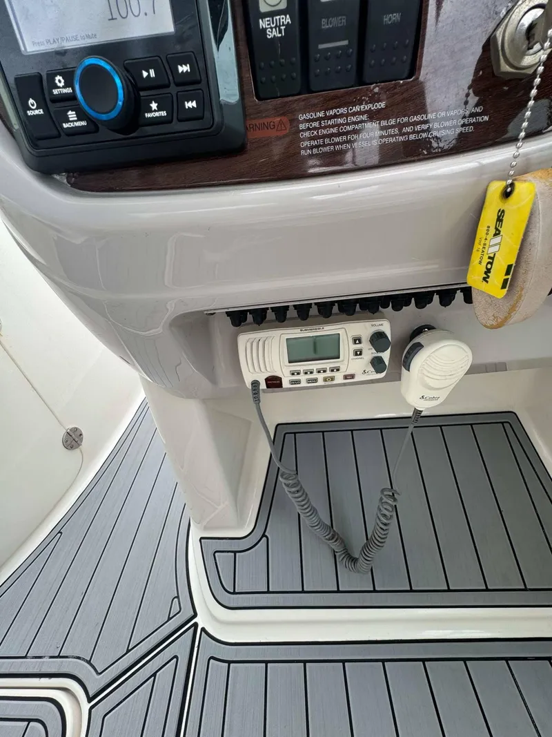 Slide: The Image of 2007 Chaparral SSX 276 boat dashboard with radio and control panel. - 22