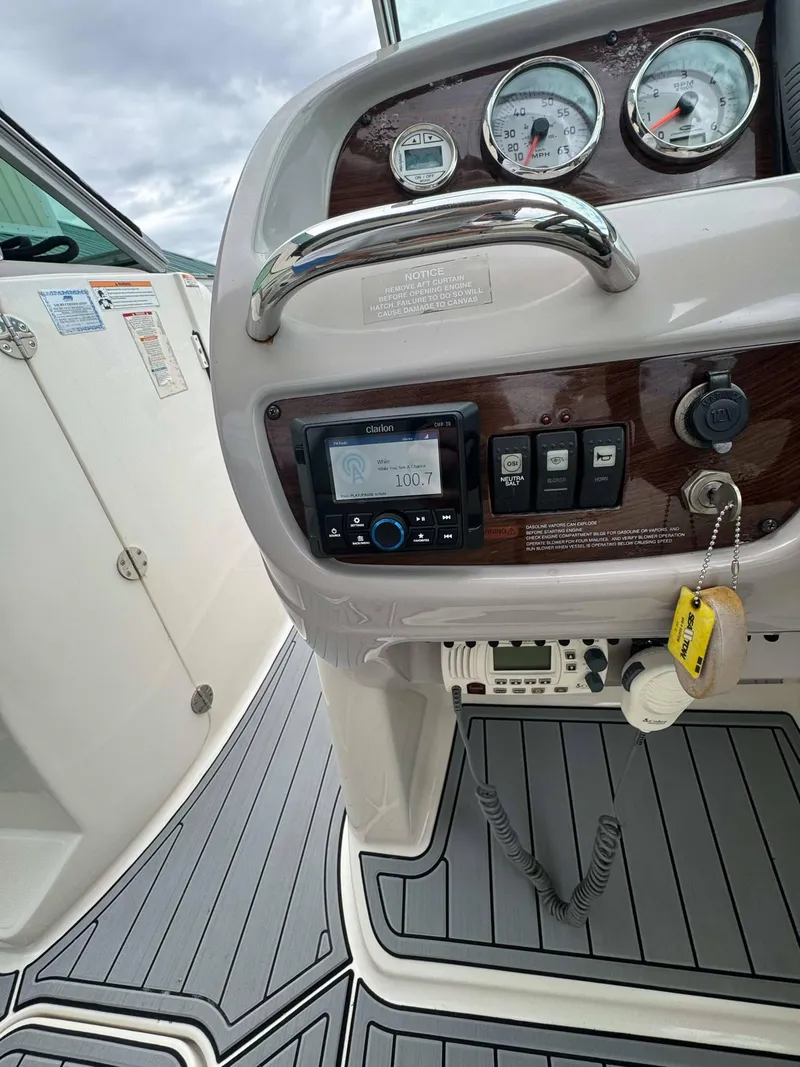 Slide: The Image of 2007 Chaparral SSX 276 boat dashboard with gauges and controls. - 23