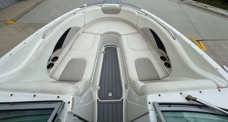 Slide: The Image of 2007 Chaparral SSX 276 boat interior with white seating and gray flooring. - 31