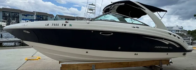 Slide: The Image of 2007 Chaparral SSX 276 boat docked, featuring sleek design and modern amenities. - 4