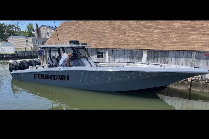 The Image of 2024 Fountain 38 SC boat docked, featuring sleek design and powerful engines. - 0