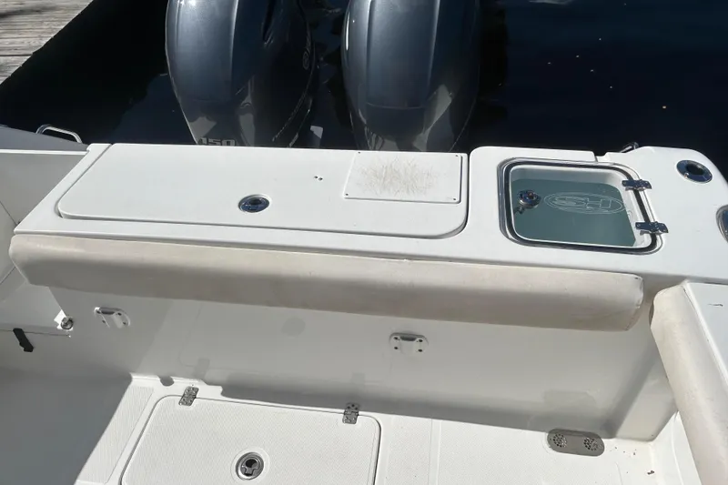 Slide: The Image of 2019 Sea Hunt Gamefish 27 boat with dual engines and storage compartments. - 7