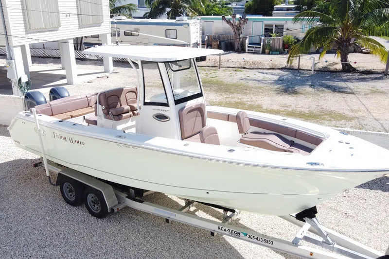 The Image of 2019 Sea Hunt Ultra 275 SE boat on trailer, parked outdoors. - 0