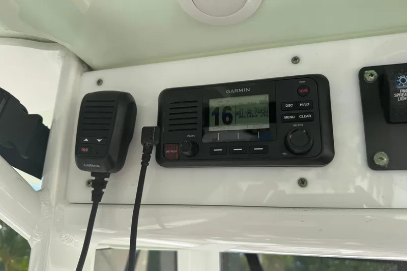 Slide: The Image of Garmin marine radio on 2019 Sea Hunt Ultra 275 SE boat dashboard. - 11
