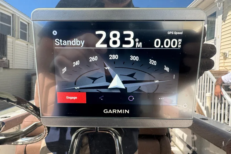Slide: The Image of Garmin navigation display on 2019 Sea Hunt Ultra 275 SE boat, showing compass and speed. - 28