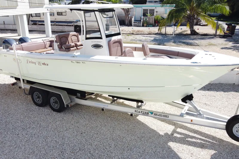 Slide: The Image of 2019 Sea Hunt Ultra 275 SE boat on trailer, parked outdoors. - 37