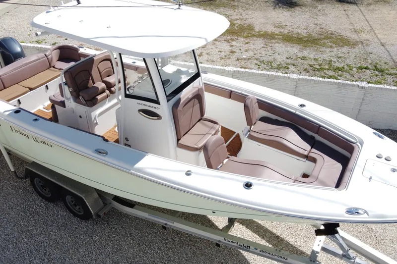 Slide: The Image of 2019 Sea Hunt Ultra 275 SE boat on trailer, featuring spacious seating and modern design. - 39