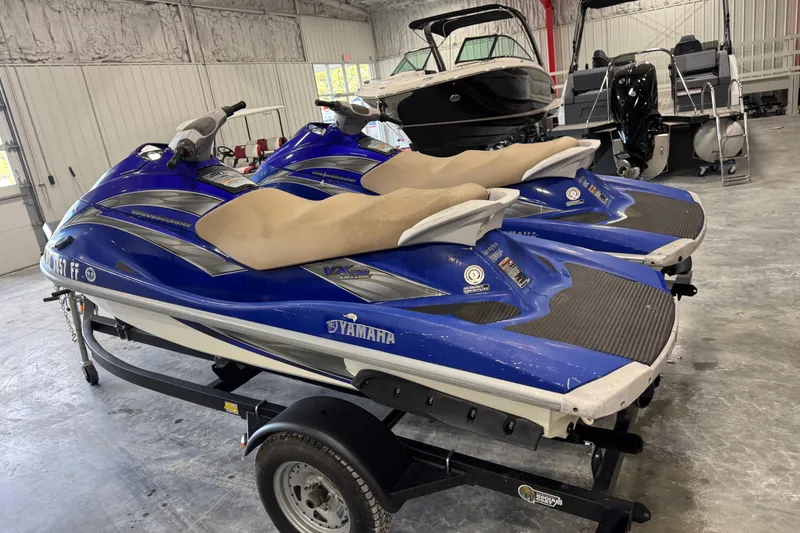 Slide: The Image of 2005 Yamaha WaveRunner VX Deluxe jet skis on trailer in storage facility. - 3