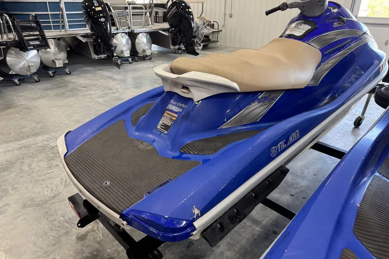 Slide: The Image of 2005 Yamaha WaveRunner VX Deluxe in blue, displayed indoors on a trailer. - 4