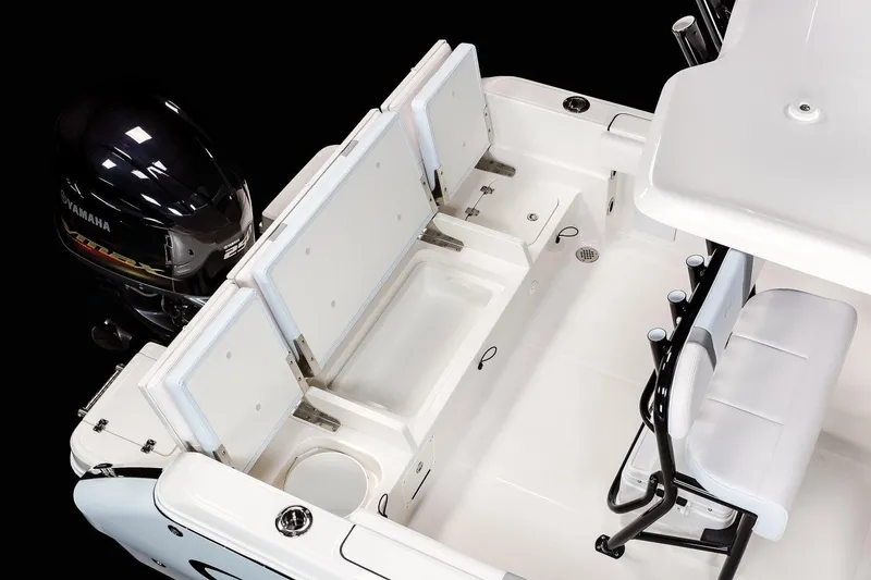 Slide: The Image of 2022 Robalo R230 Center Console boat dashboard with steering wheel and navigation controls. - 15