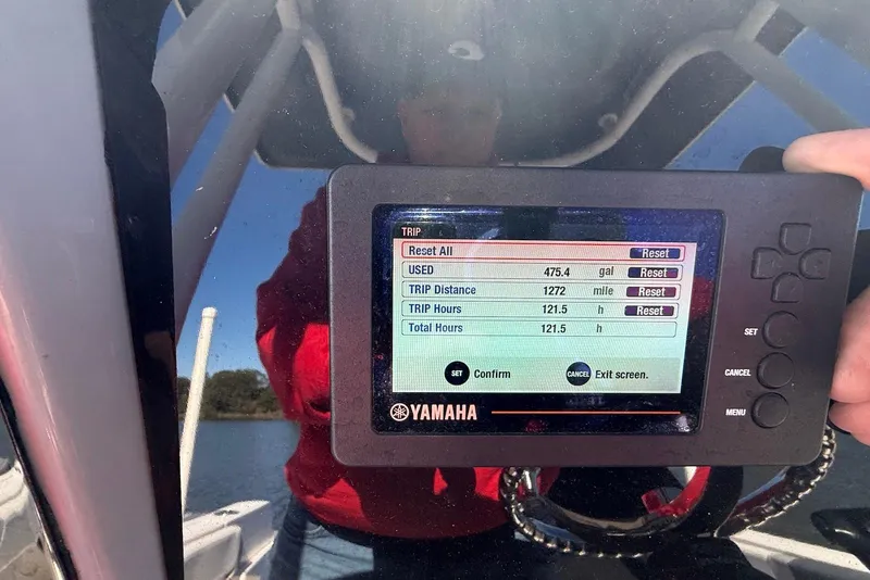 Slide: The Image of Yamaha display showing trip data on a 2022 Robalo R230 Center Console boat. - 22