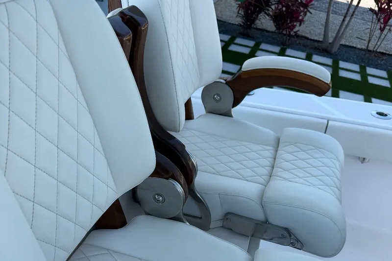Slide: The Image of Luxurious white leather seats on 2023 Jupiter 32 boat, featuring elegant diamond stitching. - 19