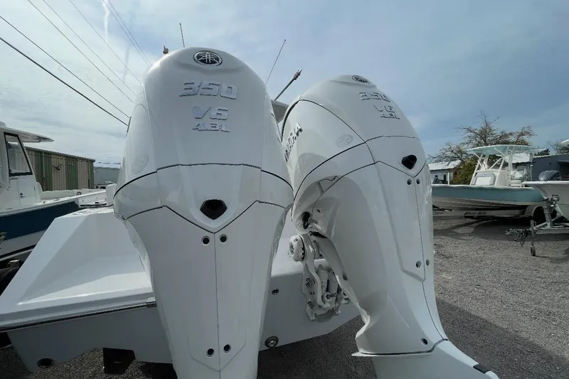Slide: The Image of Twin Yamaha 350 V6 outboard engines on a 2023 Jupiter 32 boat. - 2