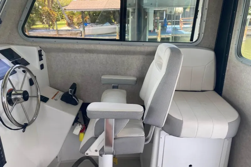 Slide: The Image of 2024 Parker 2820 XLD Sport Cabin interior with steering wheel and seating. - 10