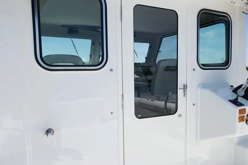 Slide: The Image of Manufacturer Provided Image: 2024 Parker 2820 XLD Sport Cabin exterior door and windows. - 12