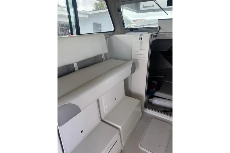 Slide: The Image of 2024 Parker 2820 XLD Sport Cabin interior with seating and storage. - 15