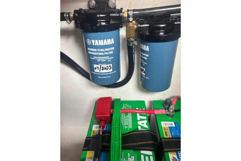 Slide: The Image of Yamaha marine fuel filter and batteries in 2024 Parker 2820 XLD Sport Cabin boat. - 23