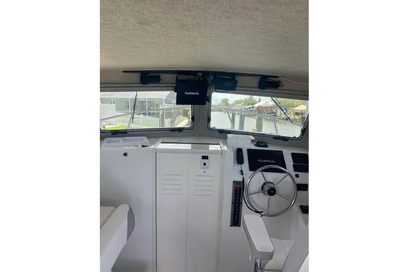 Slide: The Image of 2024 Parker 2820 XLD Sport Cabin interior with Garmin navigation system. - 4