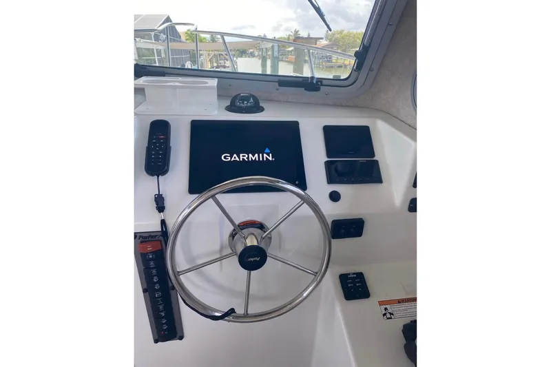 Slide: The Image of 2024 Parker 2820 XLD Sport Cabin helm with Garmin navigation system. - 6