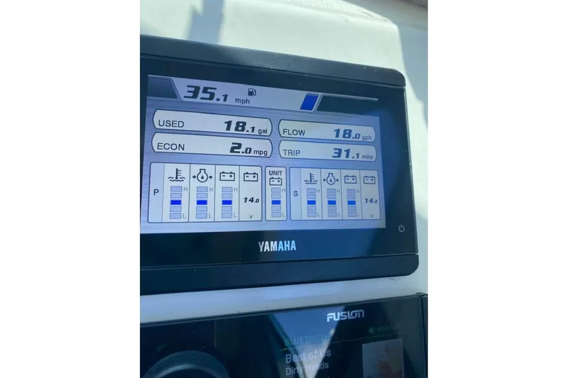 Slide: The Image of Yamaha display on 2024 Parker 2820 XLD Sport Cabin showing speed and fuel metrics. - 9