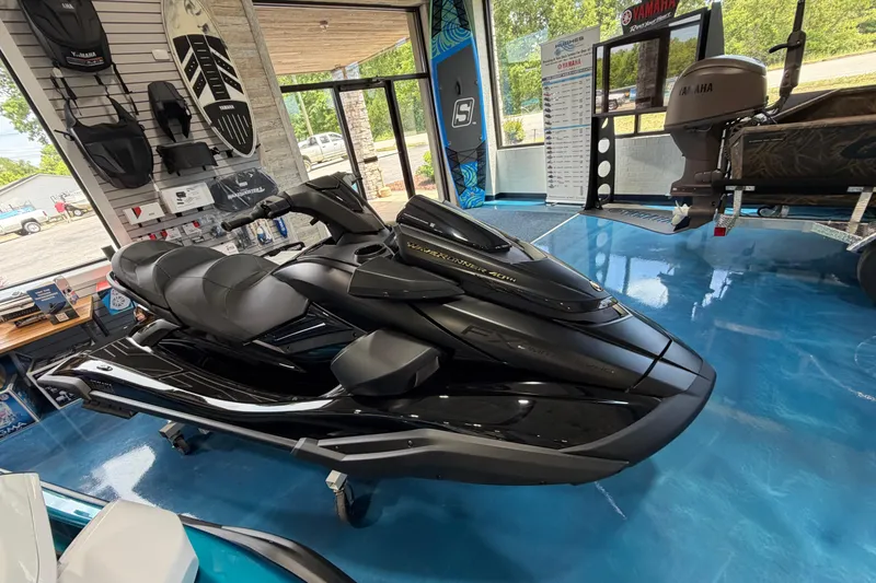 The Image of 2026 Yamaha WaveRunner FX in showroom, sleek black design, displayed on blue floor. - 0