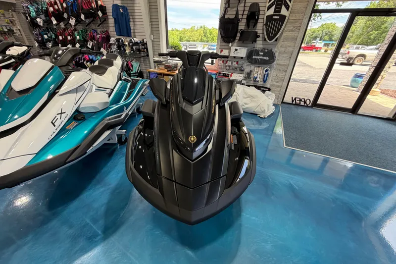 Slide: The Image of 2026 Yamaha WaveRunner FX jet ski displayed in a showroom with blue flooring. - 2