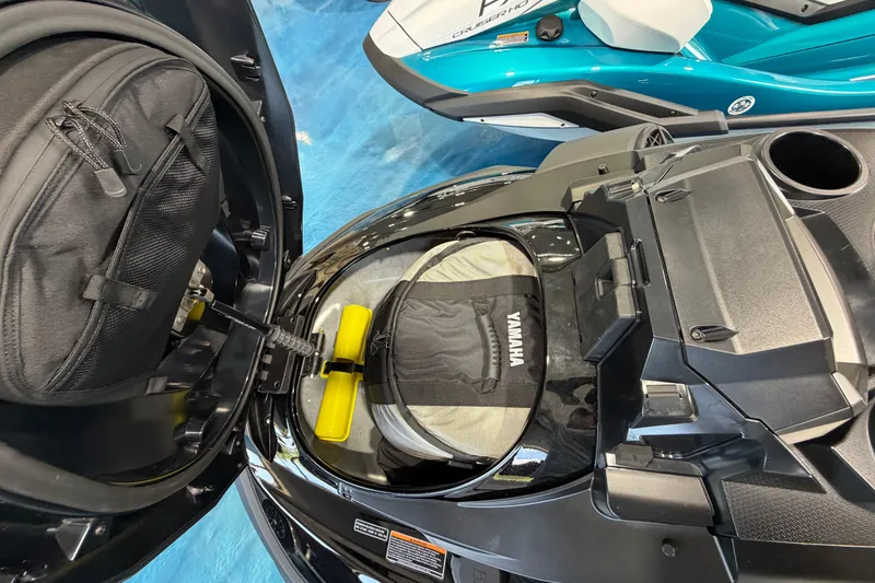 Slide: The Image of 2026 Yamaha WaveRunner FX storage compartment with gear and accessories. - 8