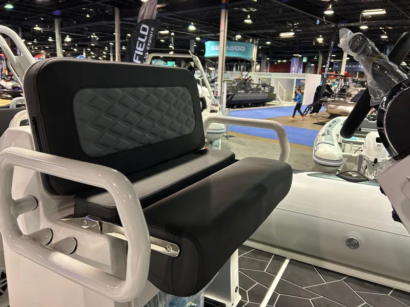 Slide: The Image of Highfield Sport 560 boat seat, 2025 model, showcased at a boat exhibition. - 6