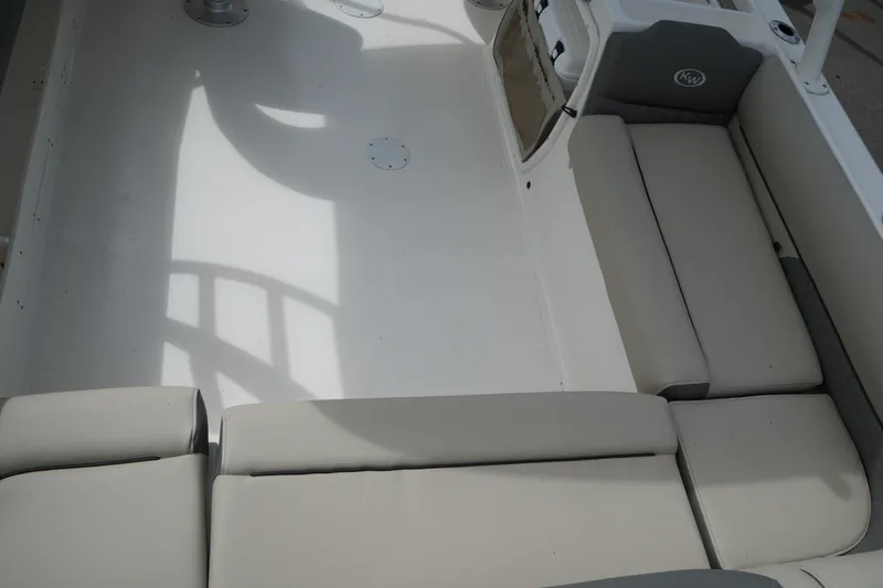 Slide: The Image of Interior view of 2026 Key West 239 DFS boat with cushioned seating. - 11