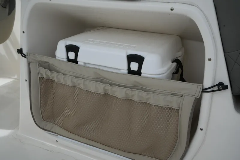 Slide: The Image of Storage compartment with cooler on 2026 Key West 239 DFS boat. - 15