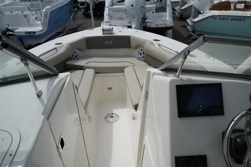 Slide: The Image of 2026 Key West 239 DFS boat interior with seating and dashboard view. - 20