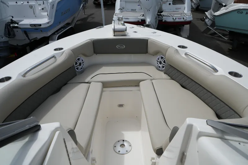 Slide: The Image of 2026 Key West 239 DFS boat interior with cushioned seating and cup holders. - 21