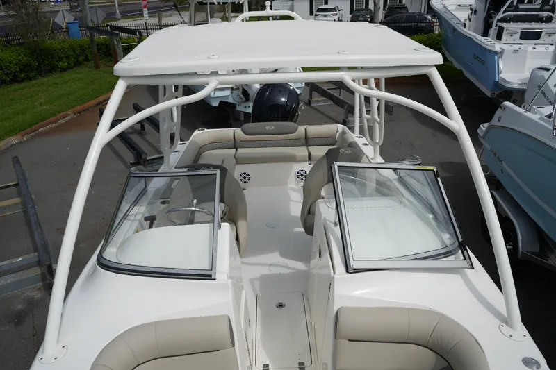 Slide: The Image of 2026 Key West 239 DFS boat with open cockpit and seating, displayed outdoors. - 25