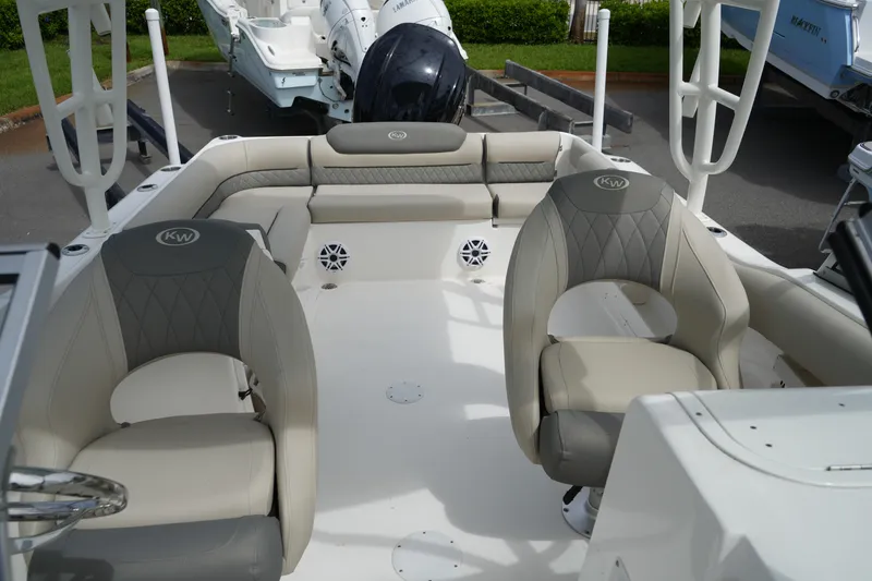 Slide: The Image of Interior of 2026 Key West 239 DFS boat with cushioned seating and modern design. - 26
