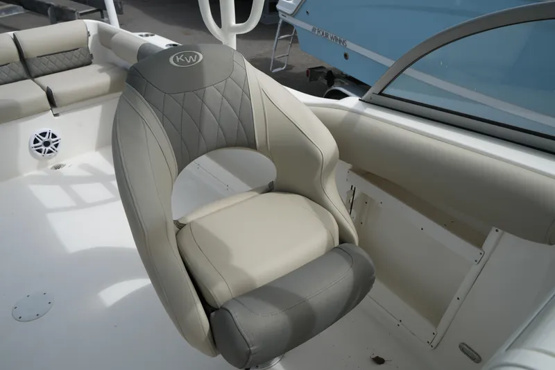 Slide: The Image of 2026 Key West 239 DFS boat seat with gray and beige upholstery. - 27