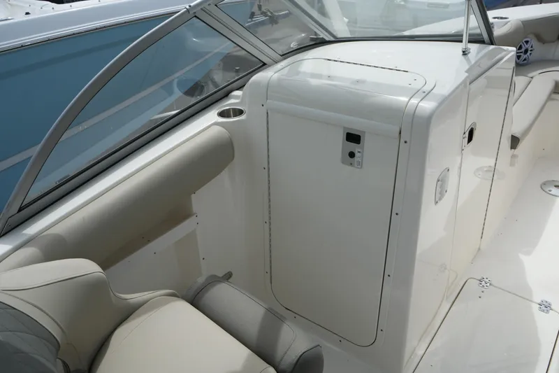 Slide: The Image of Interior view of 2026 Key West 239 DFS boat, featuring seating and storage area. - 28